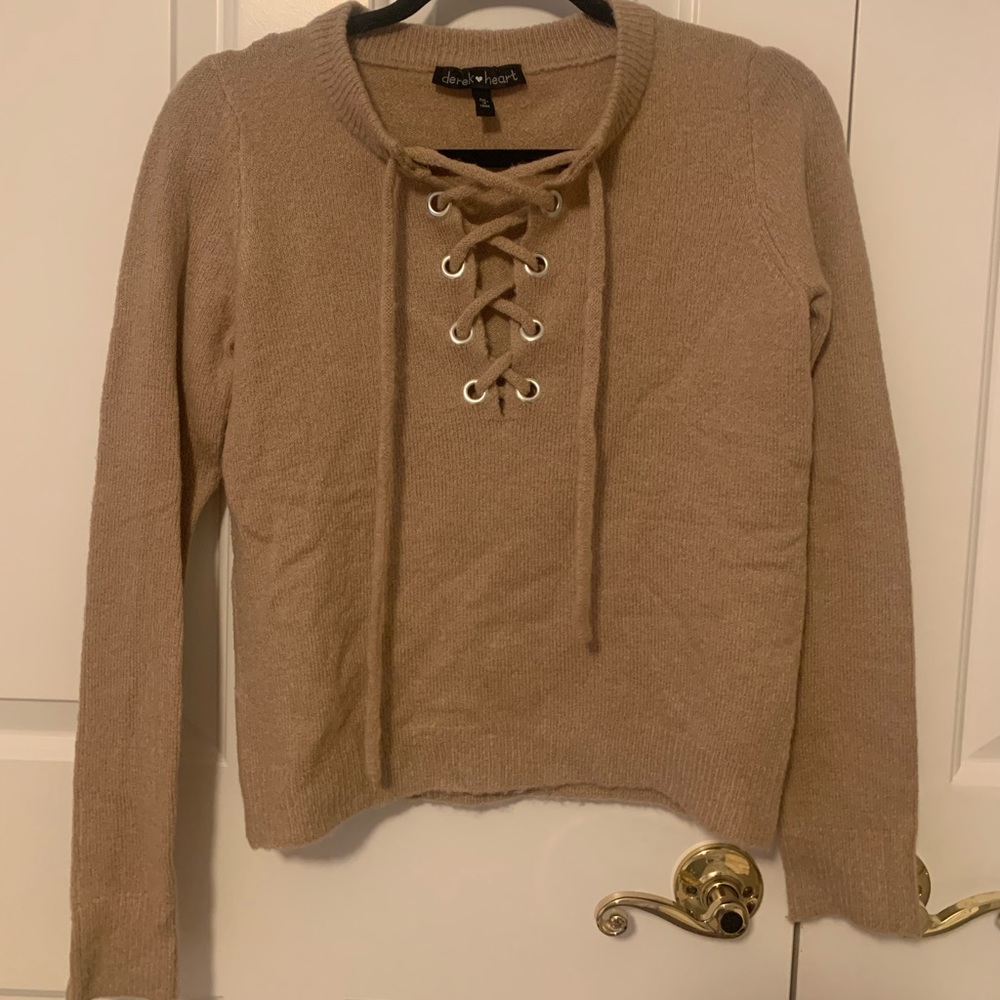 Criss cross tan sweater. Size medium.